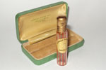 Photo © Les-parfums.info le site Rénaud - Orchid - petit flacon dans une boite metalique 