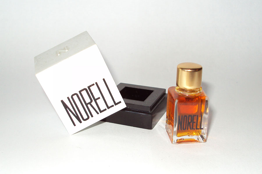 Miniature Norell de Norell Parfum etiquette doré au dos perfume inc new york 1/16 fl oz 2 ml boite plastique 