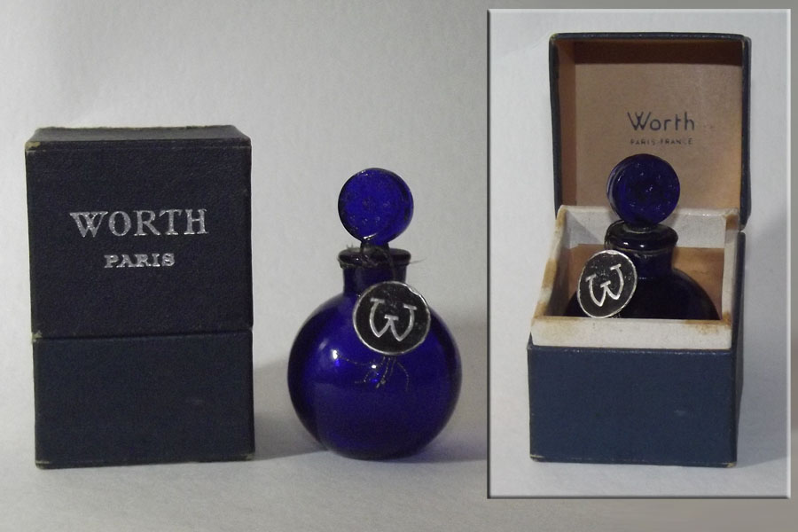 Flacon Je Reviens de Worth Flacon du parfum  en verre bleu Hauteur 6 cm environ bonchon en verre émerisé scellé vide 